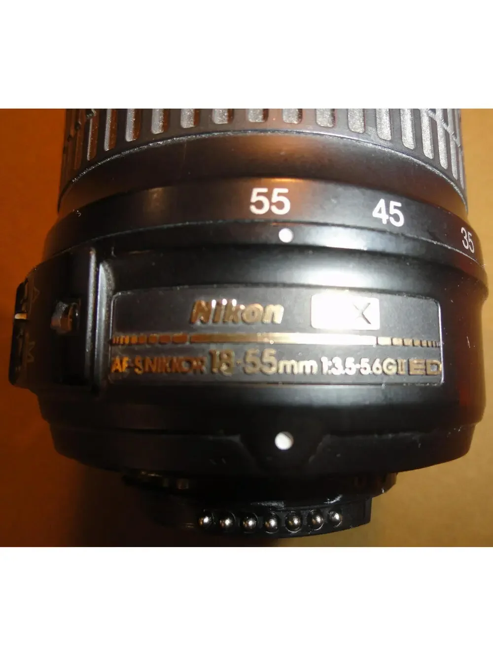 NIKON DX SWM ED ASPHERICAL 0.28M/0.92FT 52 US 6766543 18-55 MM 1:3.5-5.6 G II